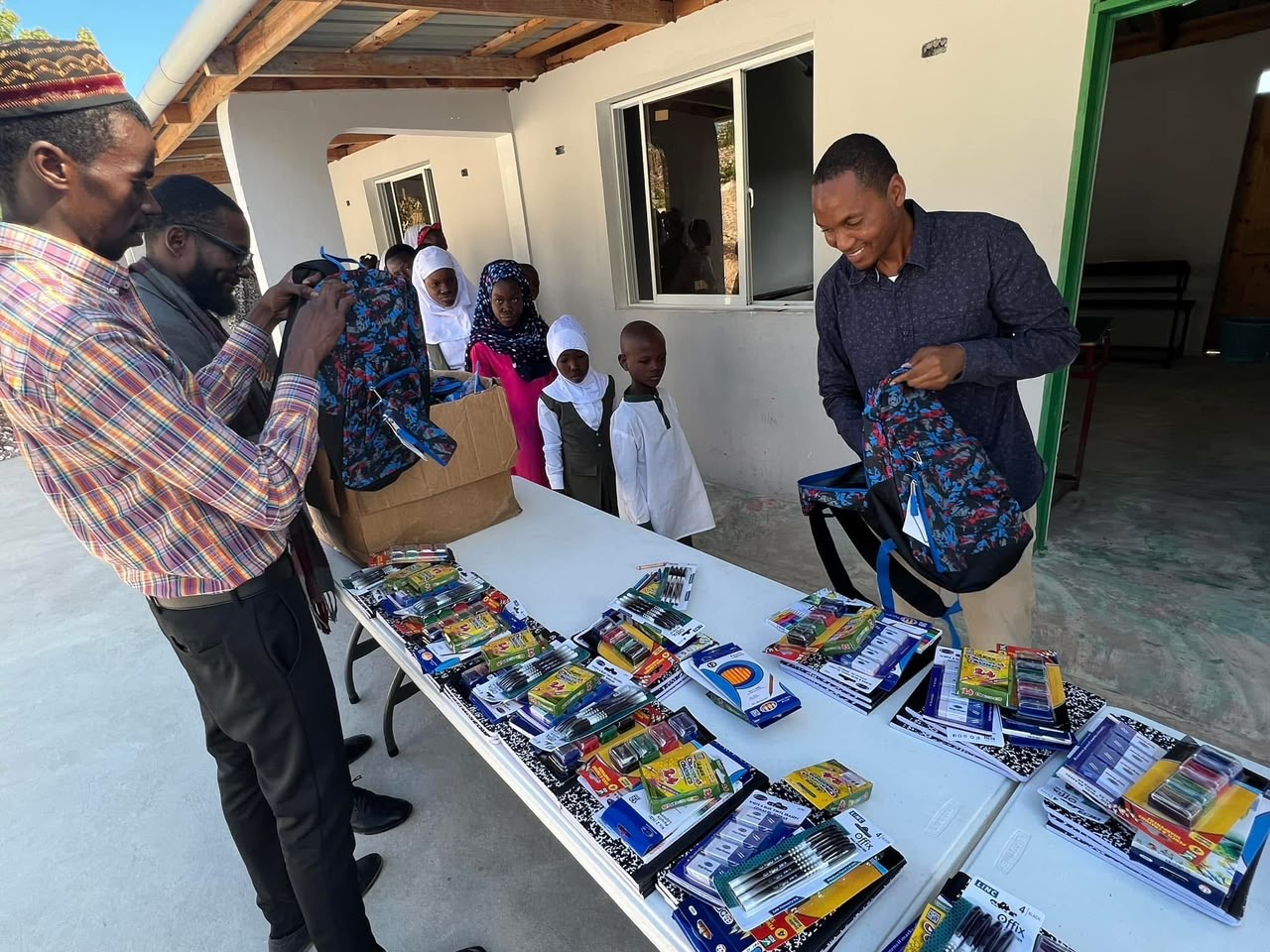 Preparing backpacks for orphans at the masjid.